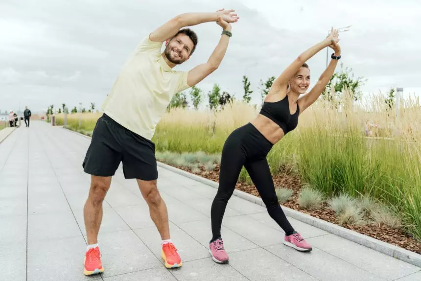 A man and a woman training together. Friends outdoor exercise physical activity for the body